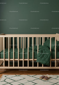 Modern Nursery with Green Bedding and Wooden Bed Frame
