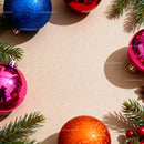 Colorful Christmas ornaments with pine branches frame