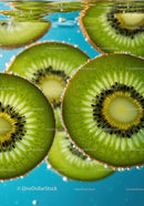 Fresh kiwi slices floating in sparkling water