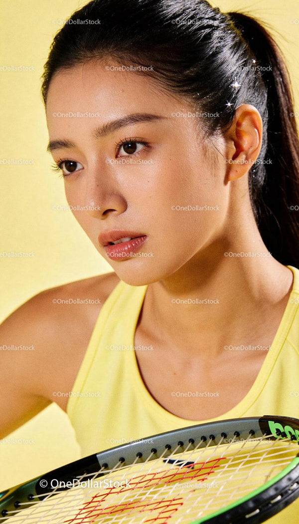 Focused female tennis player preparing for the next shot