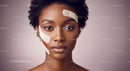 Elegant Woman Receiving Facial Skin Care Treatment with Face Masks