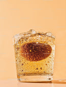 Almond immersed in sparkling water with bubbles
