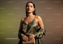 Elegant Woman Wearing Silk Top and Beige Dress with Sophisticated Style
