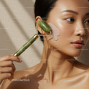 Beautiful Woman Using Jade Roller for Facial Massage and Skin Rejuvenation