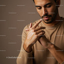 Young Man Applying Lotion for Skincare Routine in a Close-Up Shot