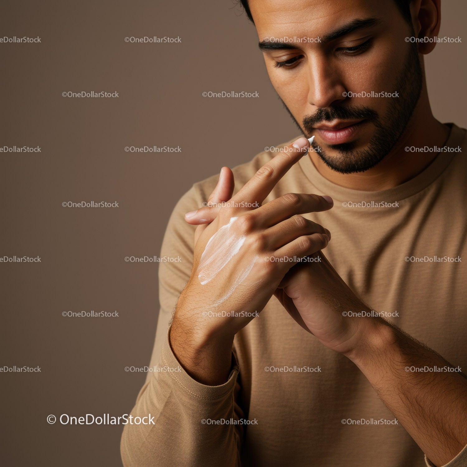 Young Man Applying Lotion for Skincare Routine in a Close-Up Shot