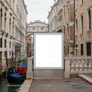 Venetian canal with gondola and historic bridge in daytime