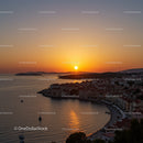 Beautiful Sunset Over Coastal Town and Calm Harbor Scene