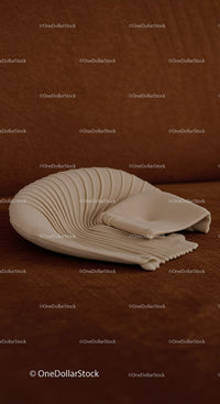 Elegant white ceramic shell sculpture on brown background