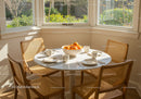 Cozy breakfast nook with oranges and natural light