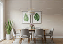 Contemporary Dining Room with Gray Chairs and Botanical Wall Art