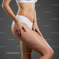 Elegant Female Body Showing Toned Legs and Silhouette in Studio