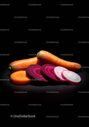 Fresh sliced root vegetables on black background