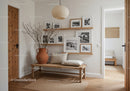 Cozy minimalist hallway with rustic wooden bench and decor