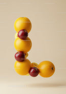 Letter L shaped with fresh citrus and apples