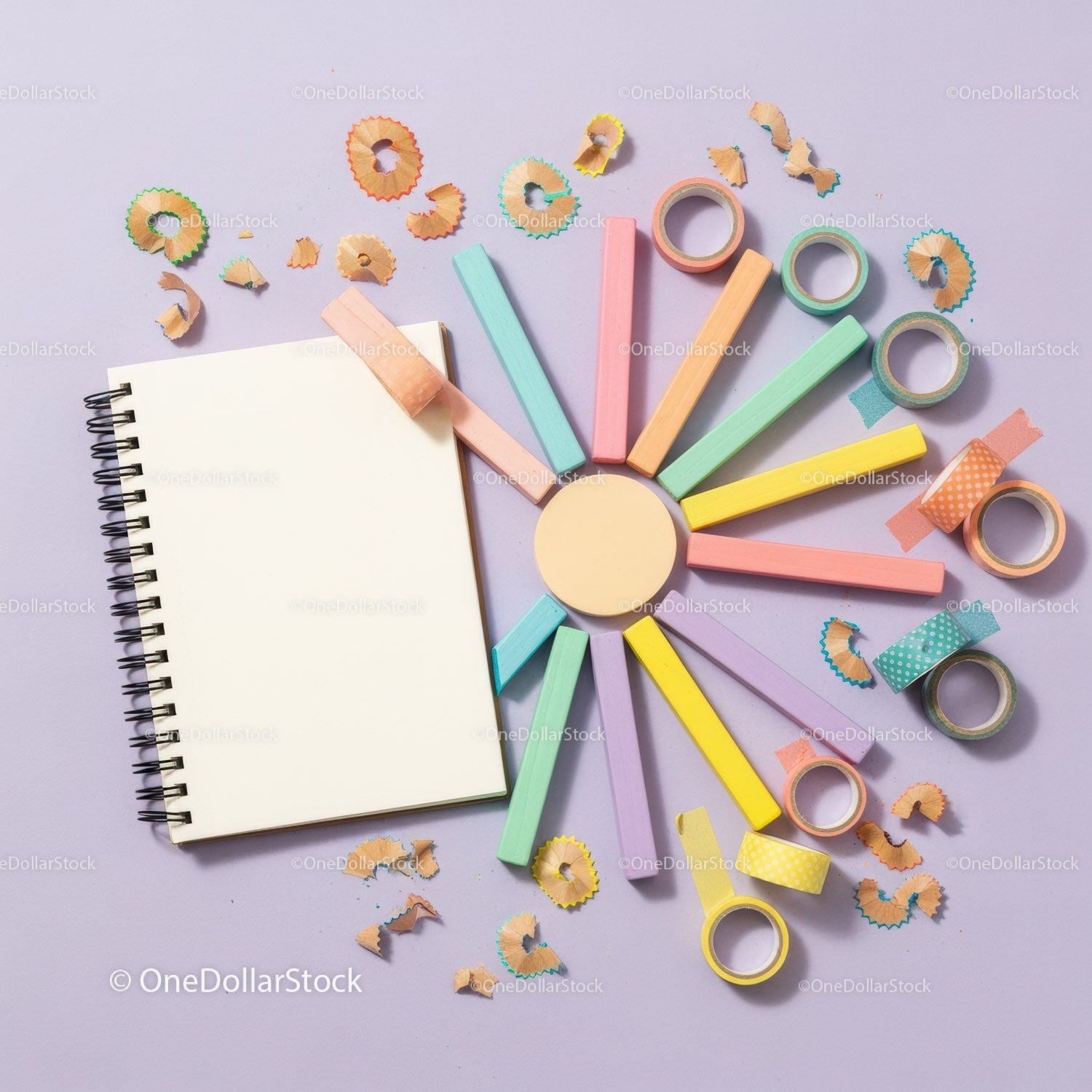 Flat lay of colorful stationery and blank spiral notebook