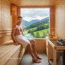 Male Man Relaxing in Wooden Sauna Room with Mountain View