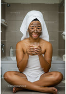 Young Woman Sitting Cross-Legged During Facial Treatment in Bathroom