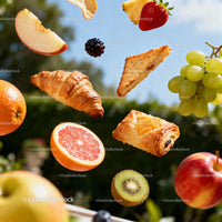 Fresh fruits and pastries floating on sunny background