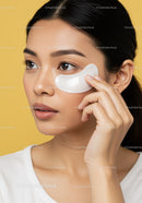 Young Woman Applying Eye Mask for Skincare and Relaxation