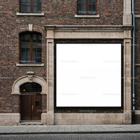 Large blank billboard on historic brick building facade