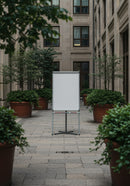 Blank flip chart in serene urban courtyard setting