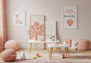 Soft Pink Child's Room Decor with Pastel Wall Art and Plush Pillows