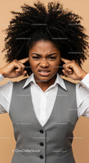 Frustrated Woman Covering Ears with Annoyed Expression