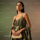 Elegant Woman in Satin Dress Holding Stylish Handbag for Fashion Shot