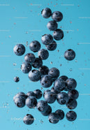 Fresh blueberries suspended in clear water with bubbles