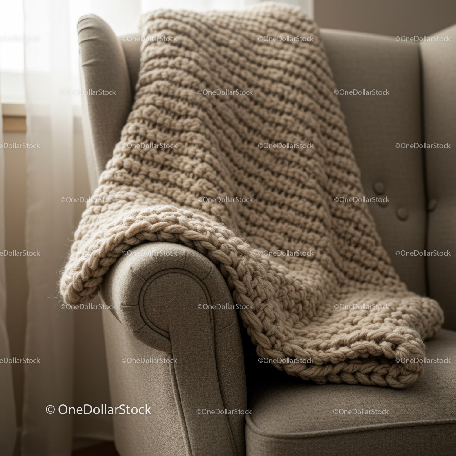 Chunky knit blanket draped over cozy armchair