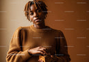 Confident Woman Wearing Cozy Brown Sweater Holding Wooden Box