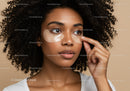 Young Woman Applying Under-Eye Hydrating Patches for Fresh Skin