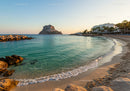 Scenic Beach with Rocky Shoreline and Mountain in Sunset Light