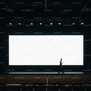 Silhouette of man walking in empty modern theater