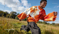 Young man enjoying outdoors in colorful knit sweater
