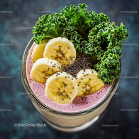 Healthy Pink Smoothie with Banana Slices and Kale