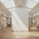 Bright boutique interior with neutral tone fashion dress display