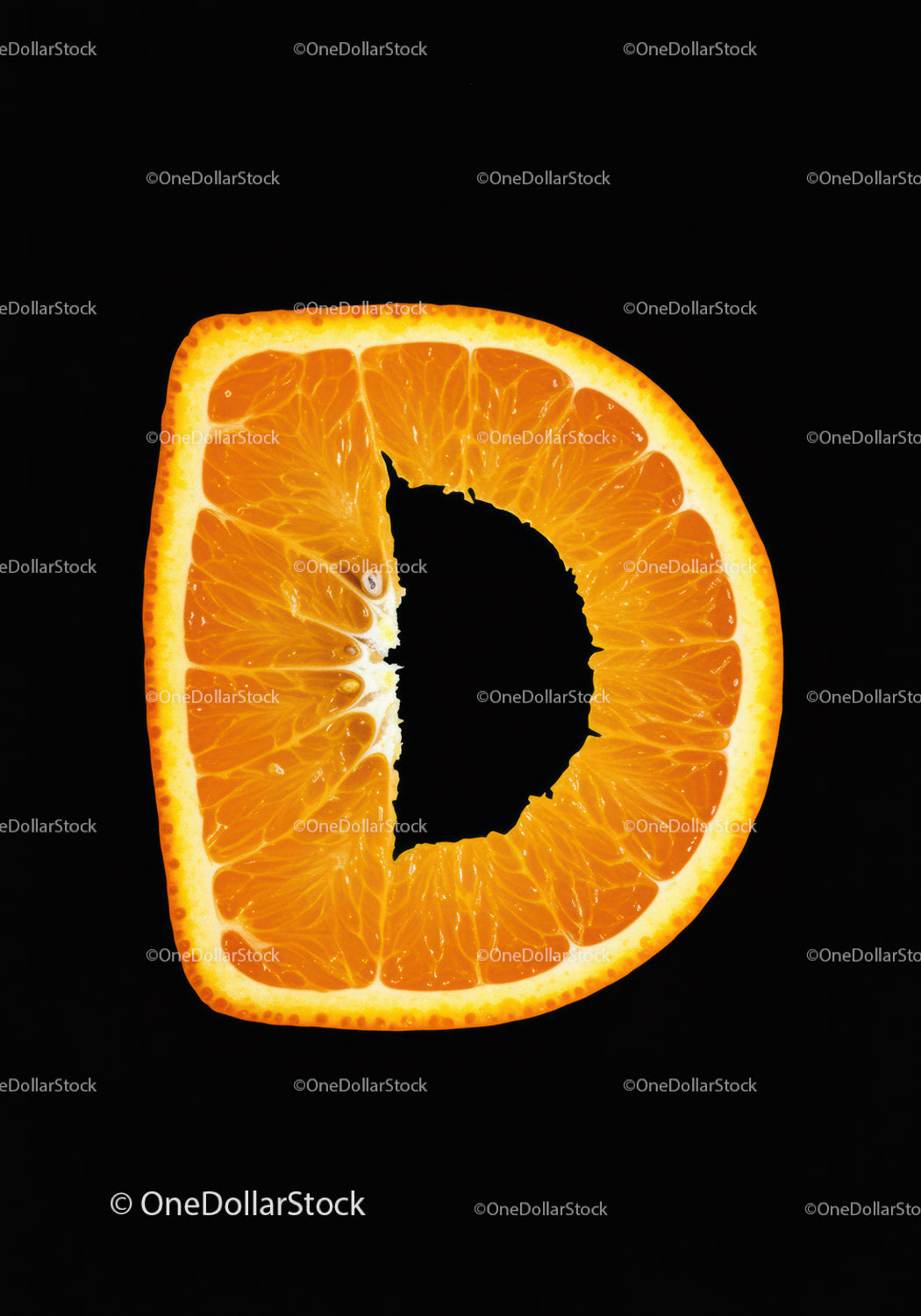 Close-up of orange slice shaped like letter D