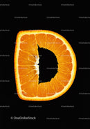 Close-up of orange slice shaped like letter D