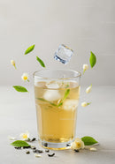 Refreshing Iced Jasmine Tea with Floating Ice and Flowers