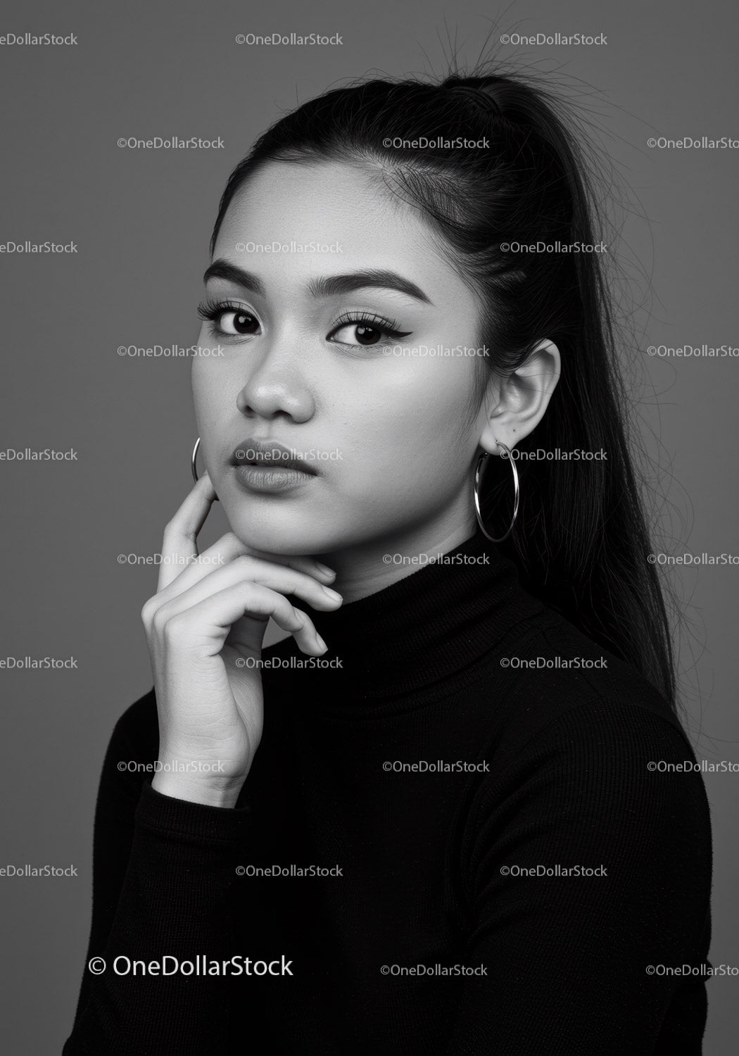 Elegant Black and White Portrait of a Young Woman with Bold Makeup