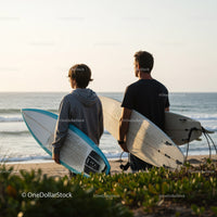 Two Surfers with Surfboards at Beach Ready for Waves