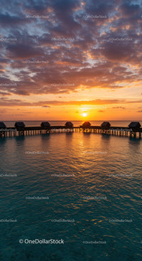Beautiful Sunset Over Calm Ocean with Overwater Bavilions