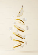 Floating Sliced Pear with Delicate White Petals