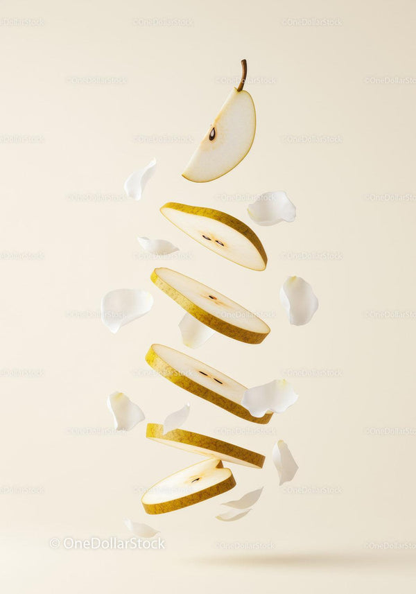 Floating Sliced Pear with Delicate White Petals