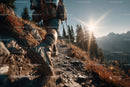 Mountaineering Hiker Climbing Rocky Mountain Trail During Sunset