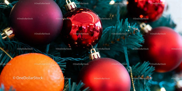 Red Christmas Ornaments Including Orange on Green Tree