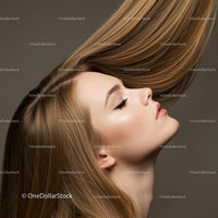 Profile of a young woman with flowing light brown hair