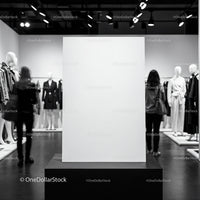 Blank white display board in modern fashion showroom